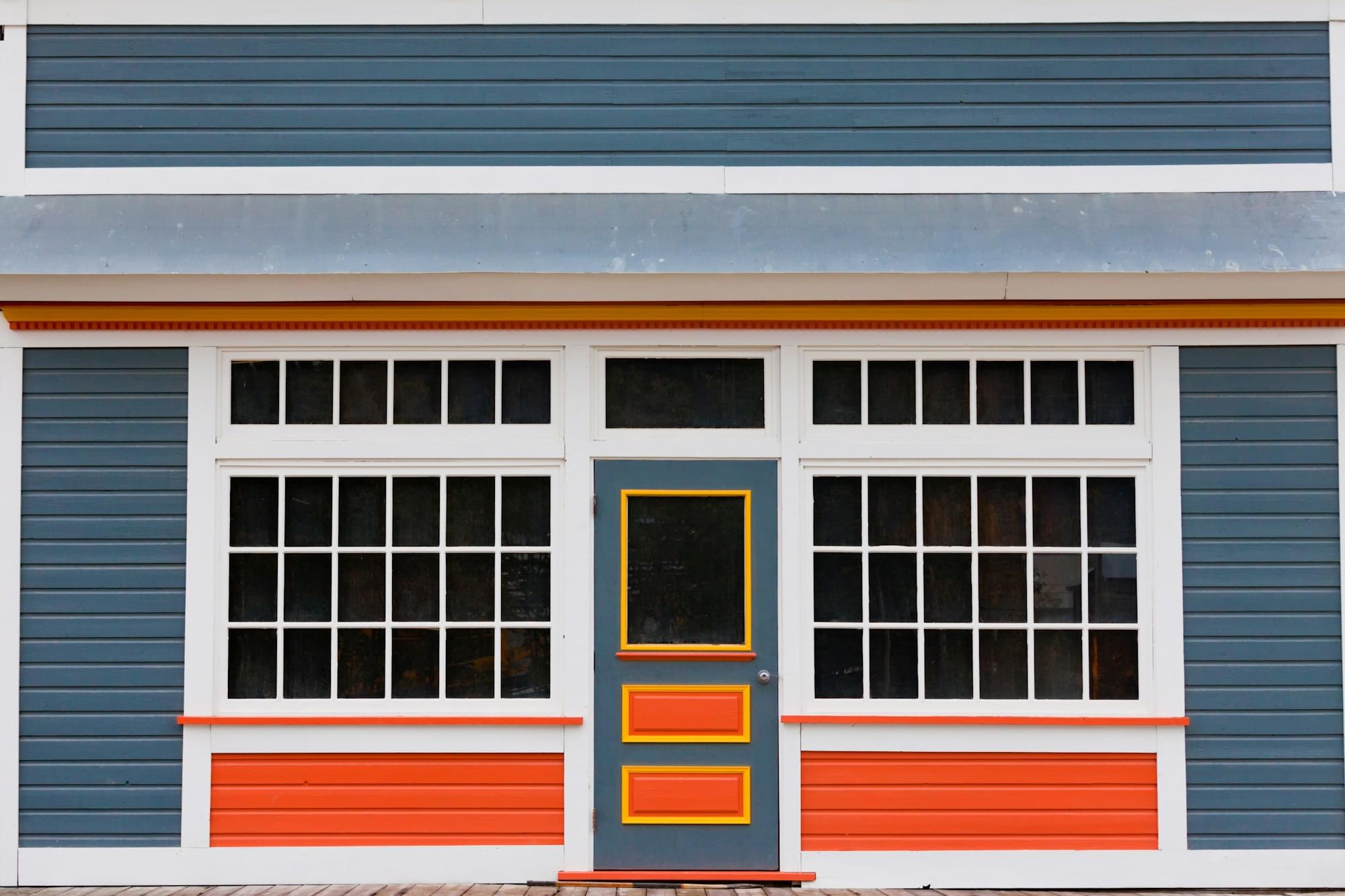 Small store front entrance colorful wooden house